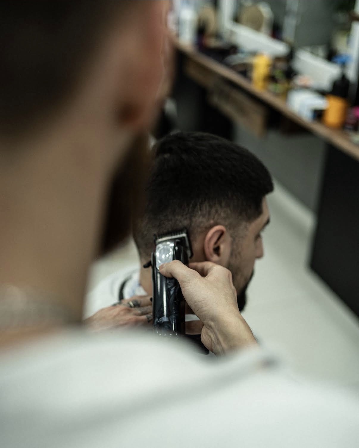 Close-up of a precision fade being cut with clippers