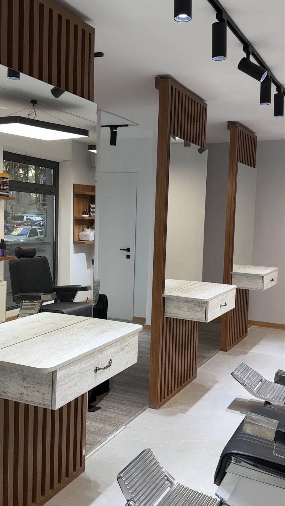 Walnut slat mirror stations at JOKER Barbershop Kazbegi